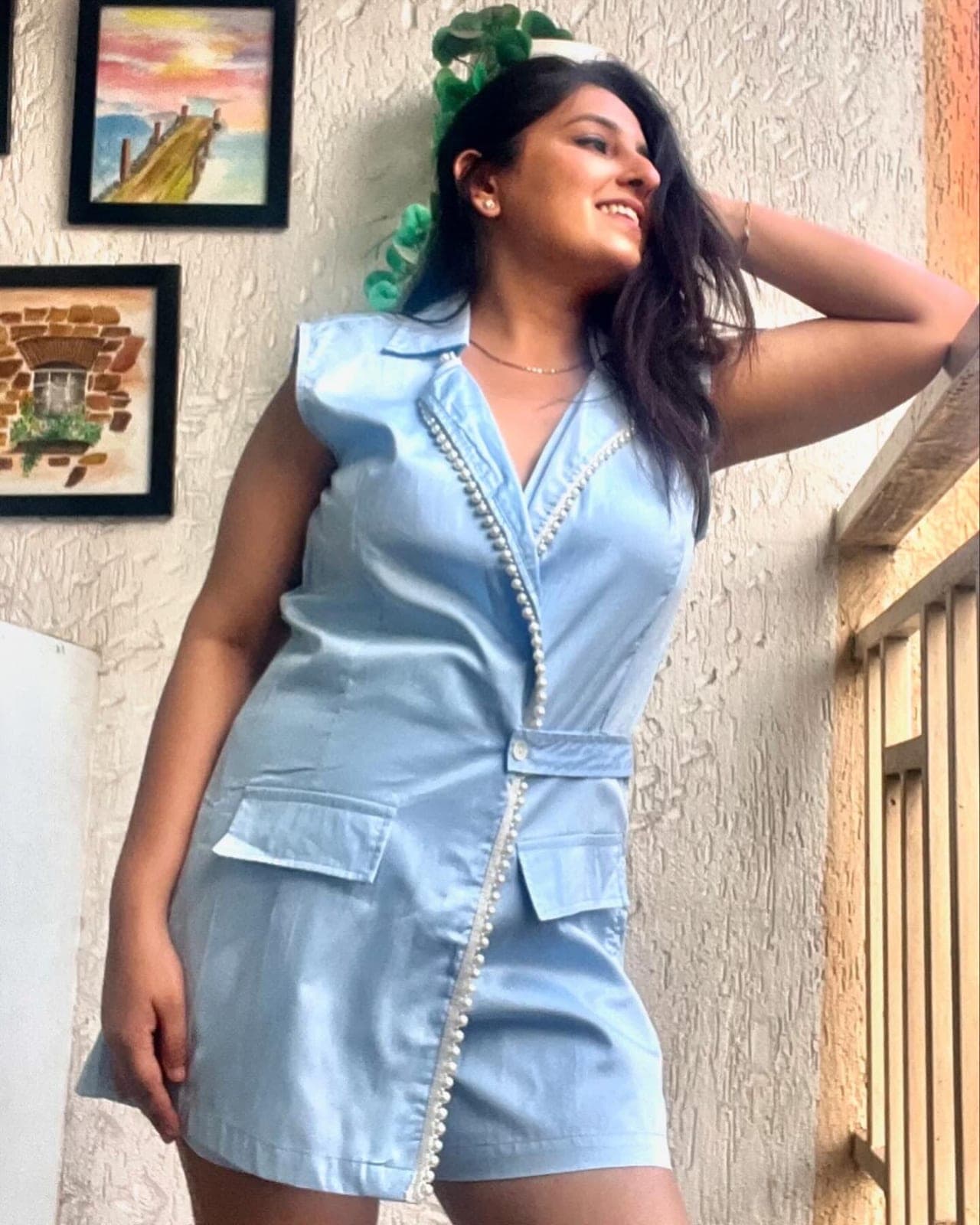 Powder blue take on the same playsuit, notched collar and buttoned waist tab, pearl beading running down the wrap edge.